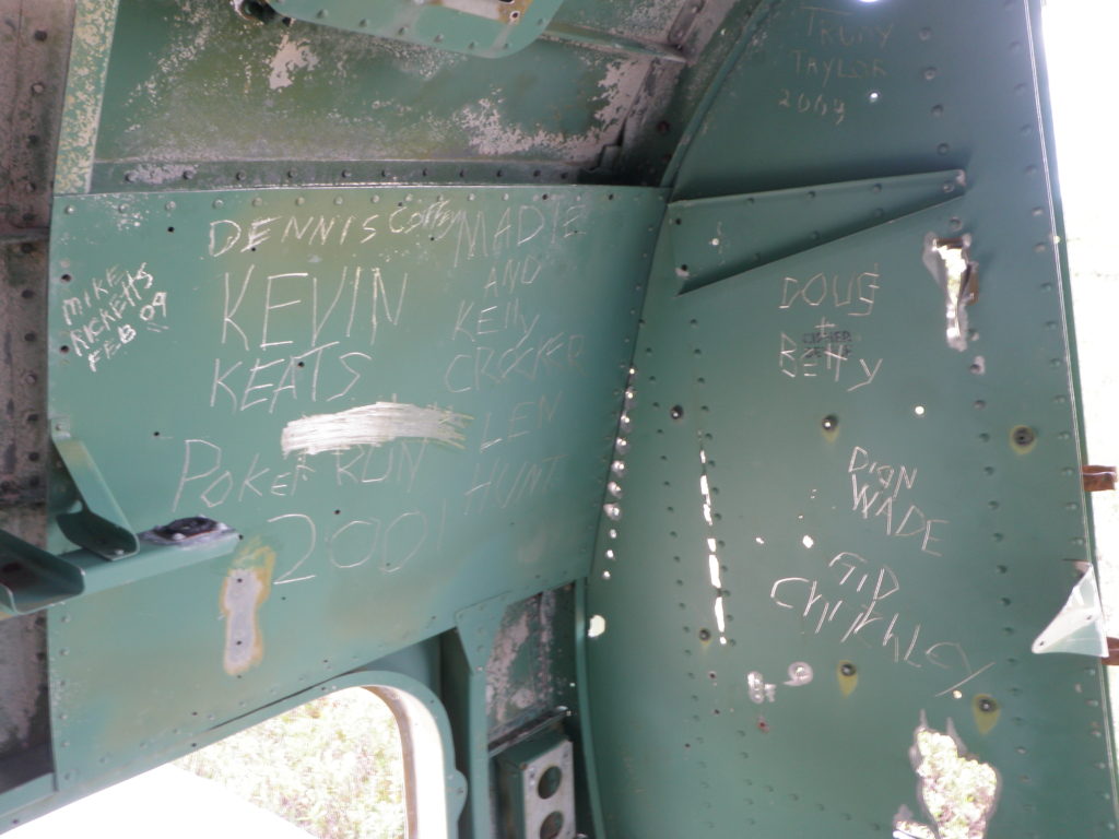 Figure 4: Graffiti scratched into the paint of the Ventura. Photo by author, 2010. 